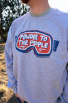 Gray sweatshirt with 'Powder to the People' graphic worn by a person outdoors.