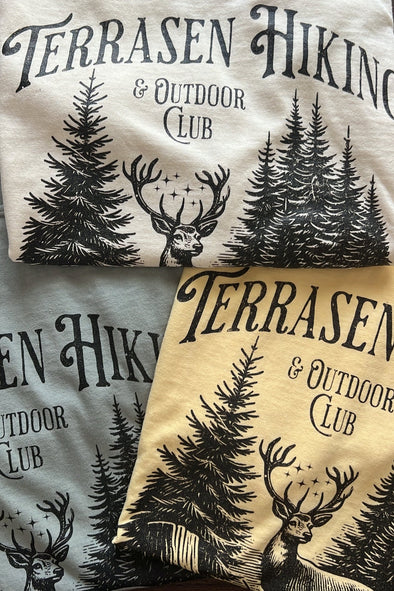 Shirts with 'Terrasen Hiking & Outdoor Club' design featuring trees and deer.