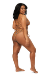 Woman wearing an orange fruit print bikini on a white background