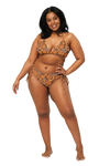 Woman wearing an orange fruit style bikini set on a white background