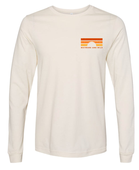 Mock up of the front of the the Dawn 'til dusk off white long sleeve. The design is a front left chest retro color pallete sunset with "Wayward & Wild" below